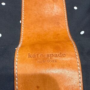 Vintage  Kate Spade Caramel Leather strap, black background with white polkadots